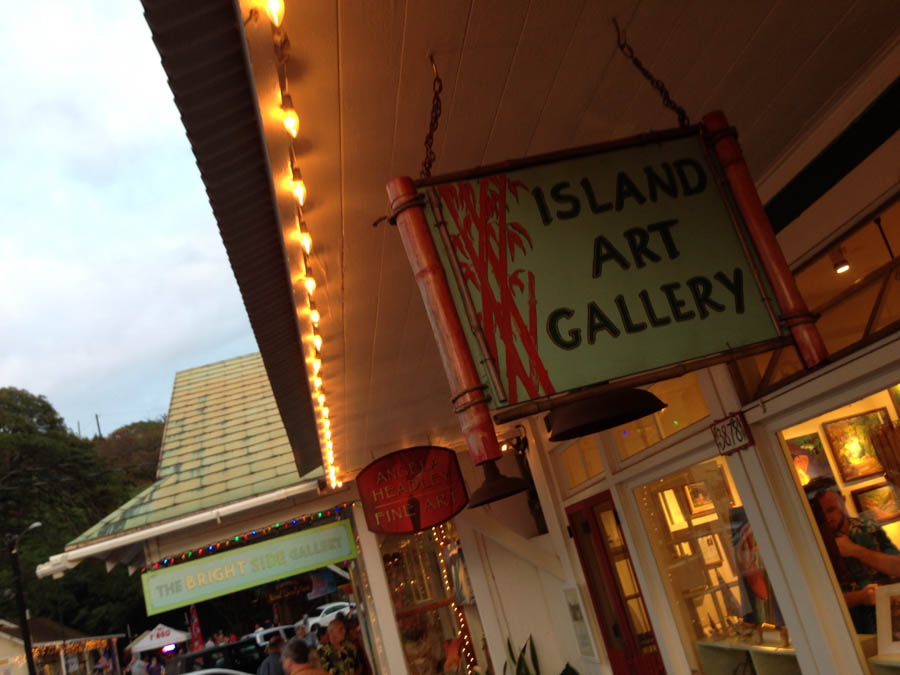 The Island Art Gallery sign under strung lights on Hanapepe art night, Kauai
