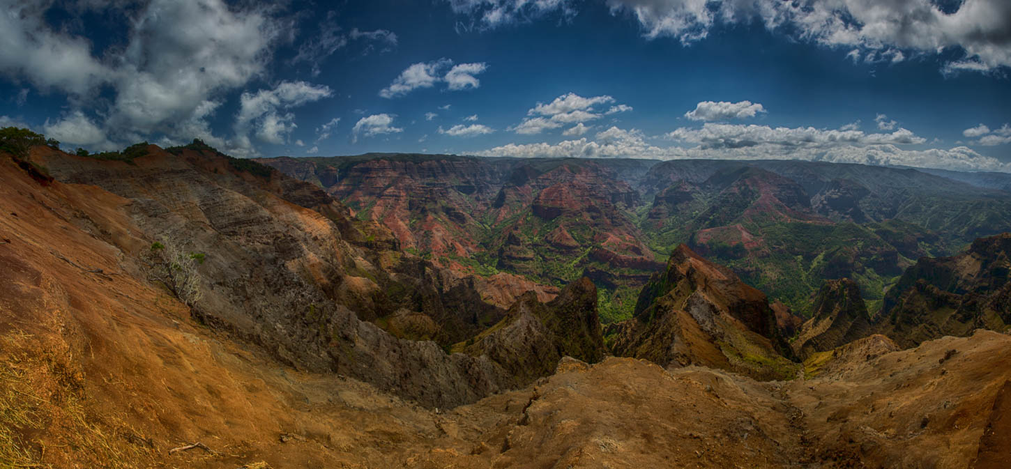 Waimea Canyon wide, red earth and green ridgelines under moving cloud, Kauai